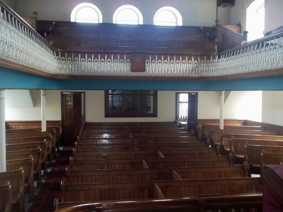 Inside Gurnos Chapel, looking from the pulpit out over the pews